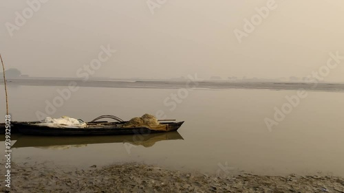 boat floating in the river | boat in the river | river bank | fisherman with his boat | ghaghra river  photo