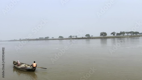 boat floating in the river | boat in the river | river bank | fisherman with his boat | ghaghra river  photo