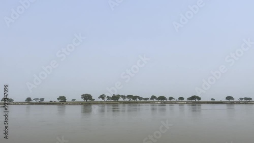 boat floating in the river | boat in the river | river bank | fisherman with his boat | ghaghra river  photo