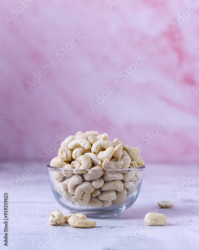 Cashew nuts in Bowl with Texture background pink Color, Heaty photo