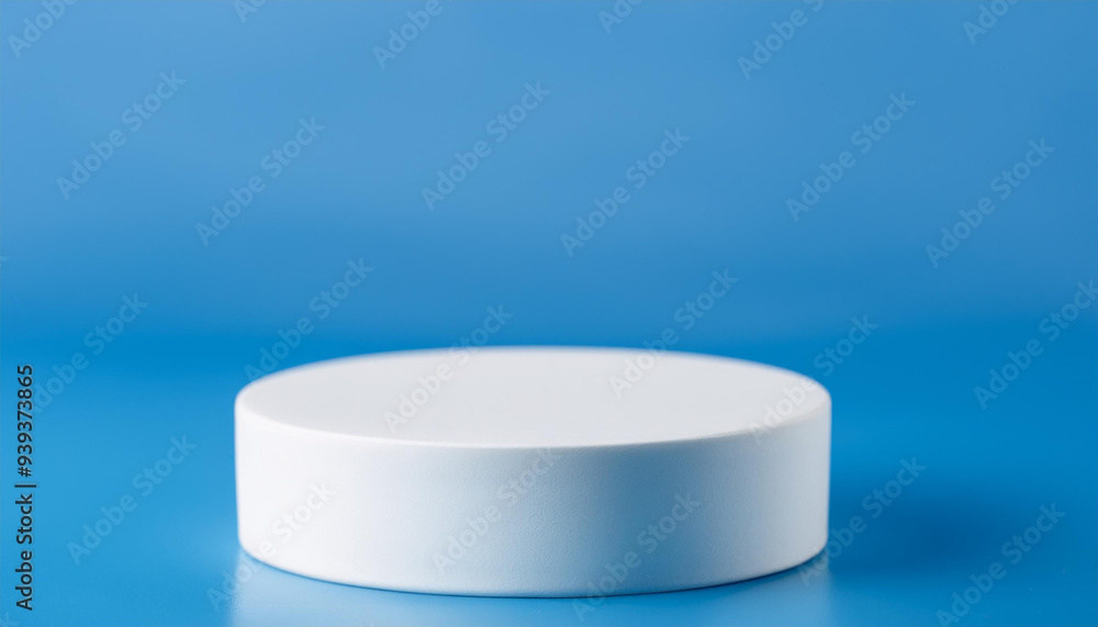 White ceramic podium. Scene for product presentation on blue backdrop. White ceramic podium. Scene for product presentation on blue backdrop.