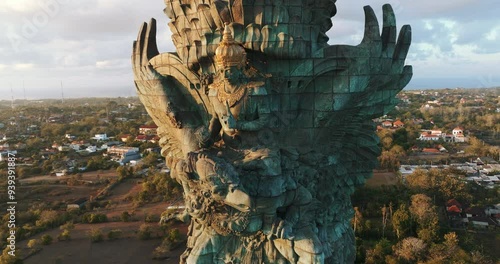 Drone Aerial view 4k Statue of Vishnu in Garuda Wisnu Kencana Cultural Park at sunrise. Bali's Most Iconic Landmark Hindu God Garuda Wisnu Kencana, Bali, indonesia. photo