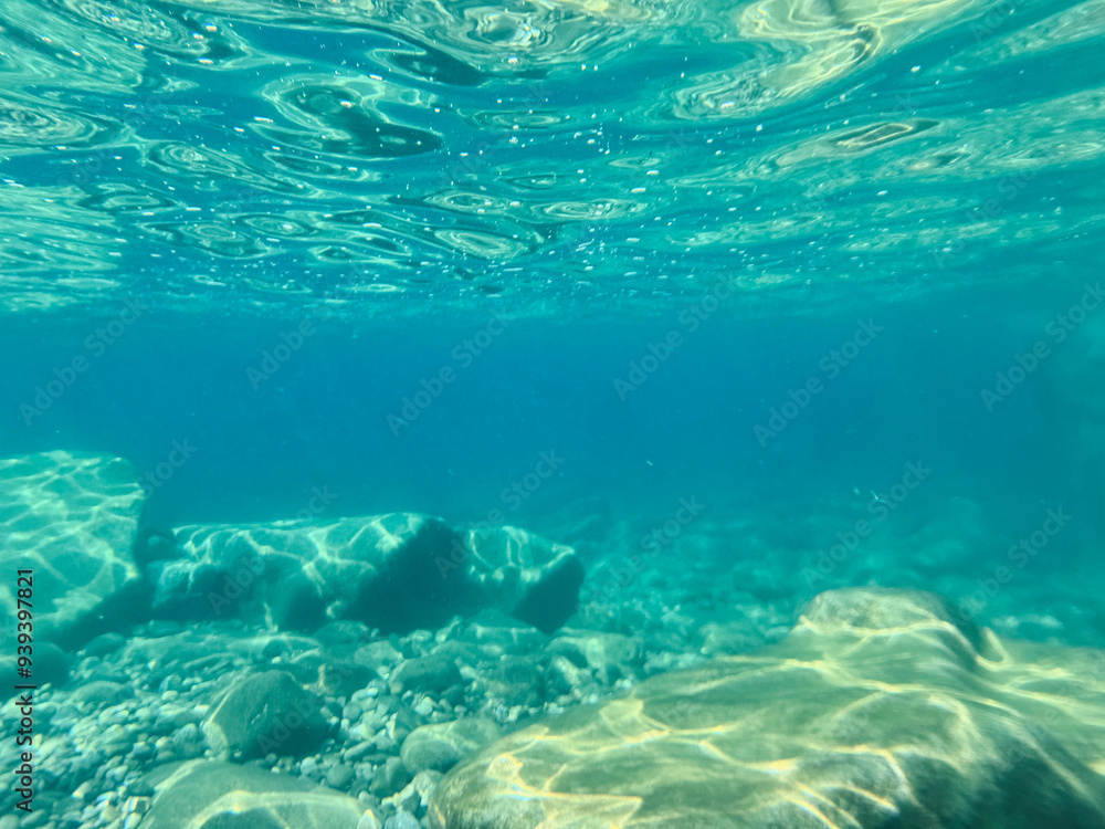 Fototapeta premium Pebble beach seen from the water.