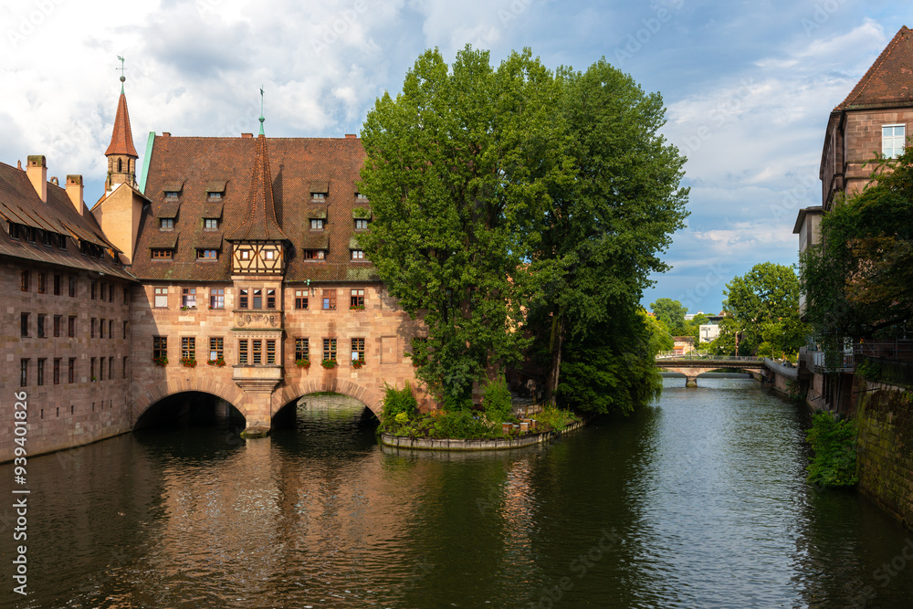 The building of Heilig Geist Spital located on the Pegnitz river in Nuremberg. The building of Heilig Geist Spital located on the Pegnitz river in Nuremberg.
