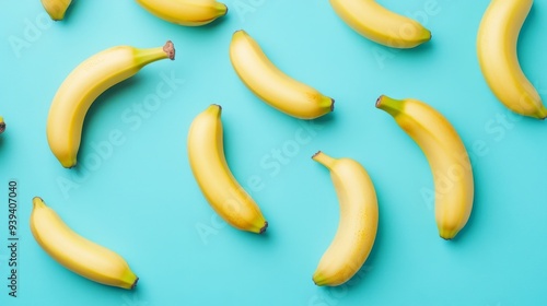 A vibrant pattern of bananas scattered over a teal background creates a lively and fun atmosphere. This image is bright and ideal for food-related projects. Perfect for fresh ideas. AI