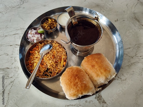 Authentic Maharashtrain spicy misal pav, Misal pav is a food of usal, sprouts curry, topped with onions, tomatoes, farsan.