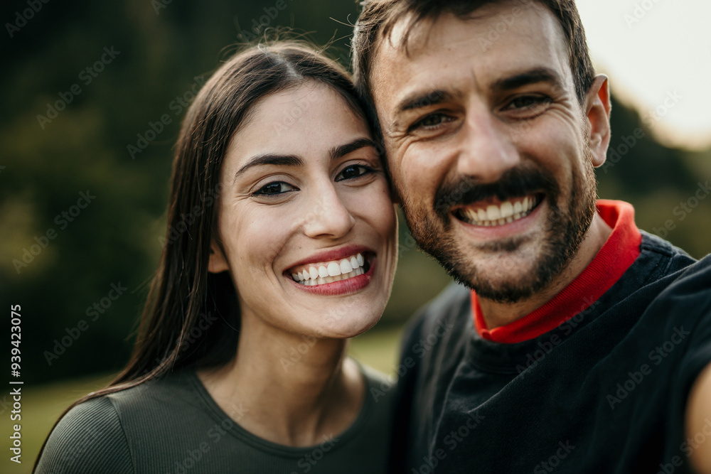 Cropped shot of two attractive young people posing for a selfie while in the nature during the day Cropped shot of two attractive young people posing for a selfie while in the nature during the day