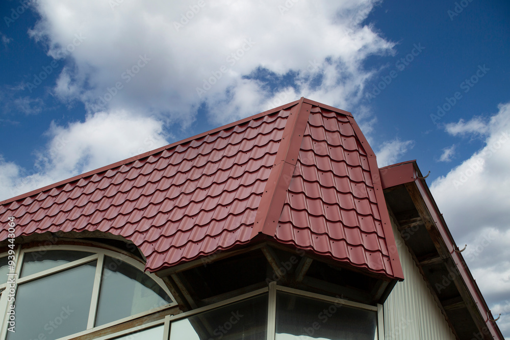 Metal tile.Roof for the house. Modern coatings for the roof of the house. Metal tile.Roof for the house. Modern coatings for the roof of the house.