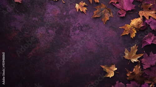 A flat lay of autumn leaves on a textured purple background.