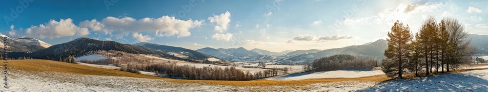 Obraz premium Vast winter landscape featuring snow-covered fields and distant mountains
