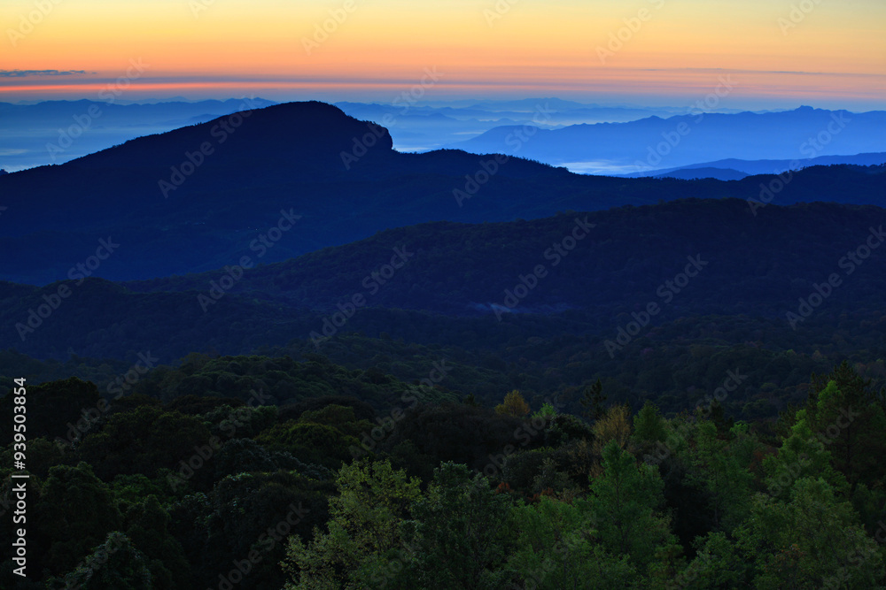 Sunrise at Doi Inthanon National Park, Mountain View morning of Doi Hua Suea Top Mountain around with soft fog with red sky background, Kew Mae Pan View Point, Chiang Mai, Thailand Sunrise at Doi Inthanon National Park, Mountain View morning of Doi Hua Suea Top Mountain around with soft fog with red sky background, Kew Mae Pan View Point, Chiang Mai, Thailand