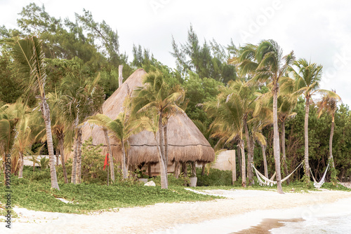 Tropical Caribbean beach people parasols fun Playa del Carmen Mexico. photo