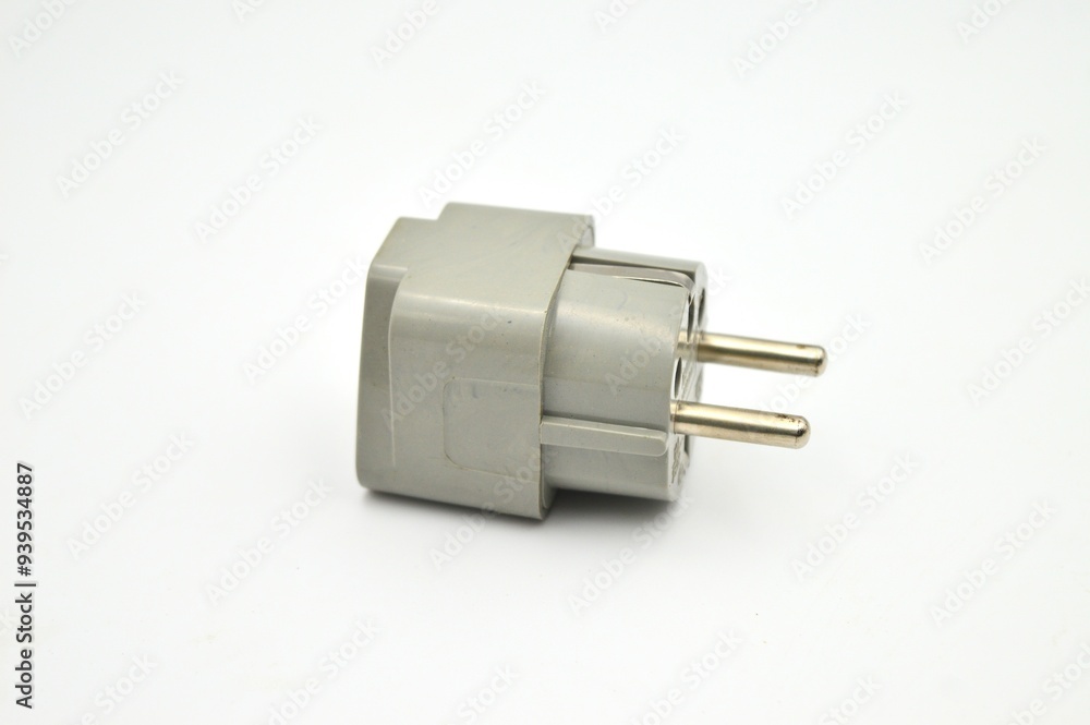 A close-up view of a universal travel adapter plug with multiple socket types, perfect for international travel A close-up view of a universal travel adapter plug with multiple socket types, perfect for international travel