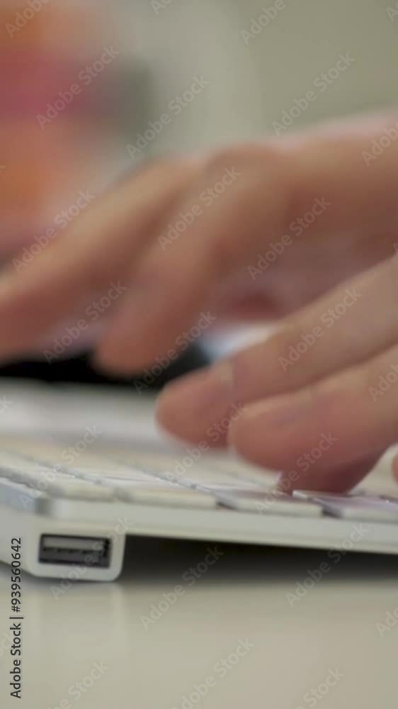 Vertical Close-Up of Hand Reaching to Pick Up Phone Handset in Office Setting Vertical Close-Up of Hand Reaching to Pick Up Phone Handset in Office Setting