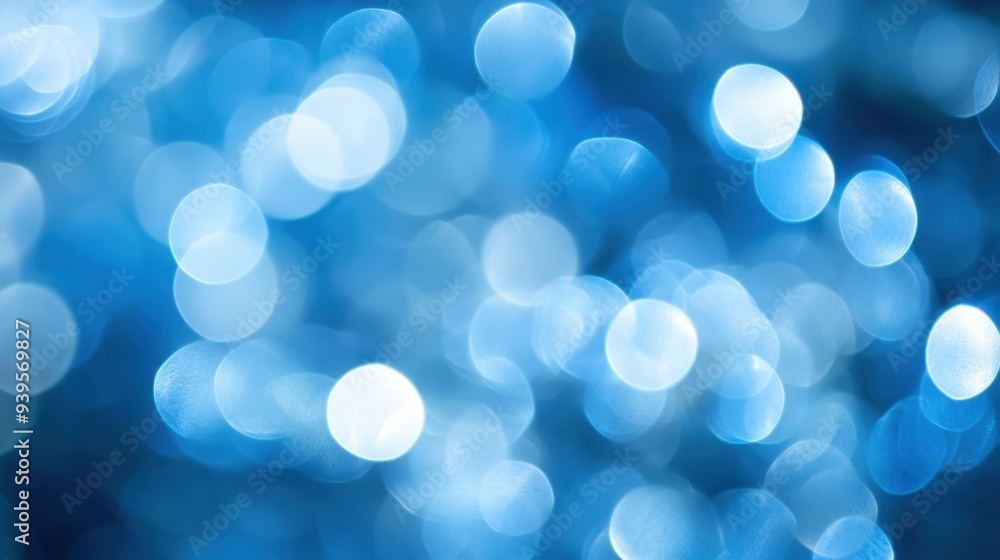 Soft bokeh lights in shades of blue and white creating a peaceful, abstract festive atmosphere. Soft bokeh lights in shades of blue and white creating a peaceful, abstract festive atmosphere.