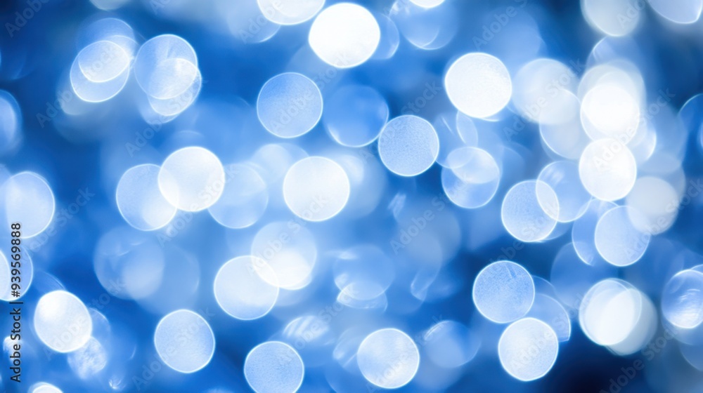 Soft bokeh lights in shades of blue and white creating a peaceful, abstract festive atmosphere. Soft bokeh lights in shades of blue and white creating a peaceful, abstract festive atmosphere.