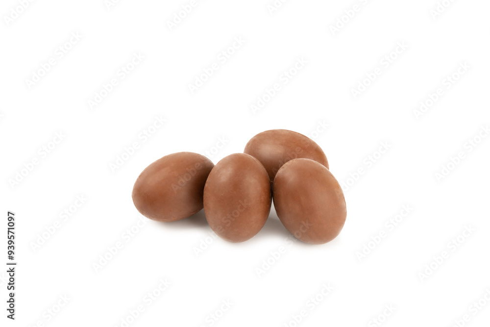 Easter chocolate egg isolated on white background. Easter celebration concept. Happy Easter. Chocolate sweet eggs. Candies on textured wooden table. Space for text.Copy space Easter chocolate egg isolated on white background. Easter celebration concept. Happy Easter. Chocolate sweet eggs. Candies on textured wooden table. Space for text.Copy space