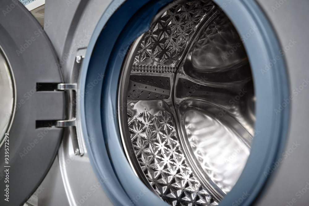 Close-up of open a washing machine drum. Close-up of open a washing machine drum.