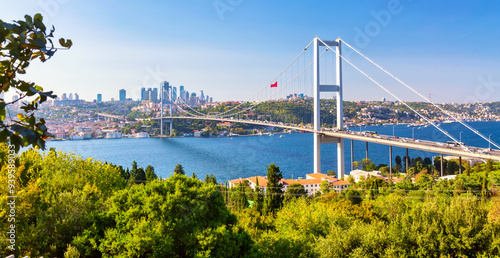 Istanbul Bosphorus Bridge or 15th July Martyrs Bridge with Istanbul panorama cityscape during summer sunny day. Istanbul, Turkiye. photo