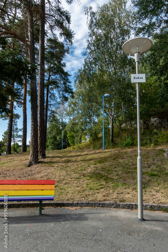 Stockholm, Sweden Aug. 24, 2024 A colorful park bench in the park in the Rinkeby suburb. photo