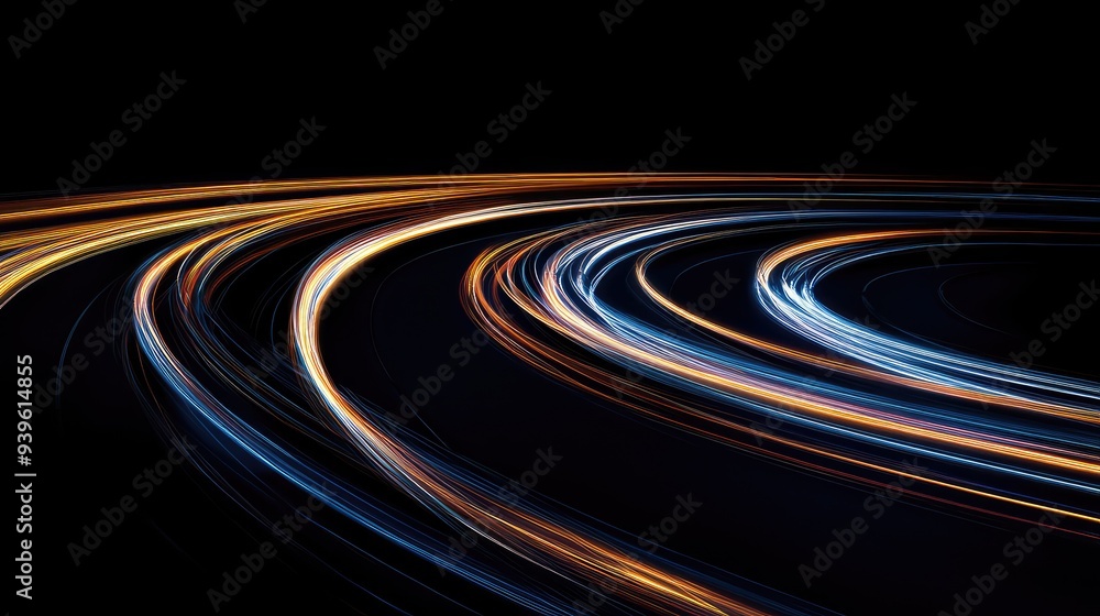 Fototapeta premium Curved light trails forming an abstract pattern on a black background, resembling a dynamic and winding road.