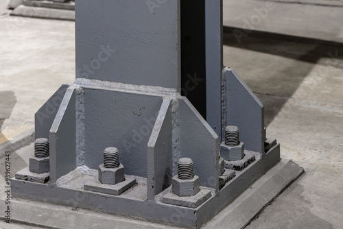 Принти на полотні Detail of a steel vertical support beam bolted to the floor in an industrial fac