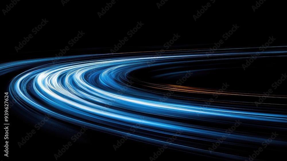 Abstract light trails resembling a curved road, winding across a dark background, creating a sense of movement. Abstract light trails resembling a curved road, winding across a dark background, creating a sense of movement.