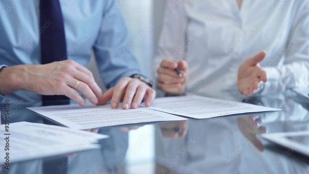 Fototapeta premium Business people are reviewing a contract and discussing the terms of the agreement. Lawyers at work