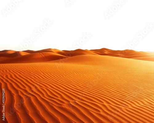 Golden sand dunes stretch into the horizon under a clear sky, showcasing the natural beauty and tranquility of the desert landscape. photo