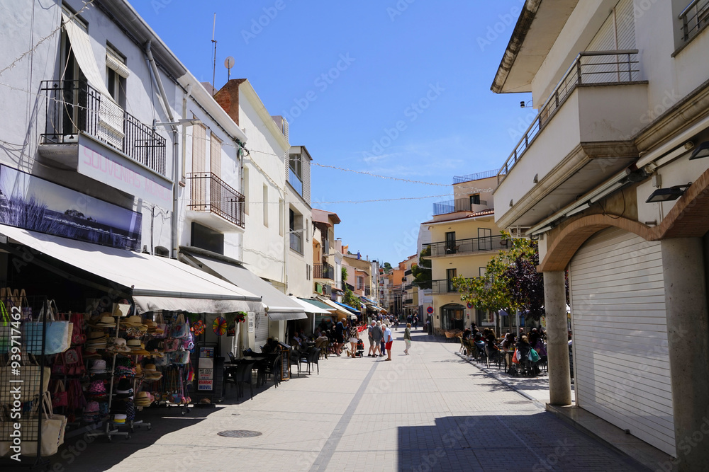 Fototapeta premium street with shops, restaurants and bars in the city centre of l'Estartit, holiday, vacation, Catalonia, Costa Brava, Barcelona, Girona, Spain