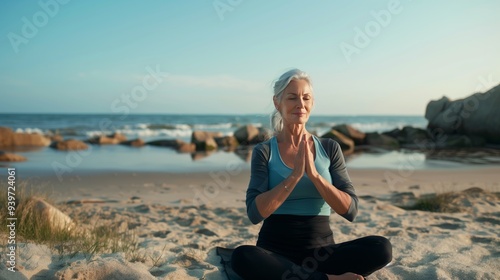 editorial photo of mature woman doing yoga on the beach, elegant sport clothes, atmosphere of calm and wellneess --ar 16:9 --stylize 50 --v 6 Job ID: 087b2a67-93f9-4c61-a881-7126c770b0ba