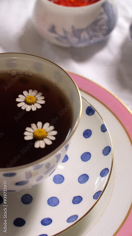 Chamomile Flowers in Tea Cup with Polka Dot Saucer Chamomile Flowers in Tea Cup with Polka Dot Saucer