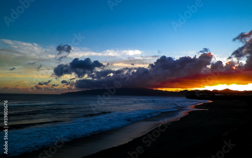 Beautiful sunset over beach in Ribiera Grande, Atlantic Ocean, Azores Islands. photo