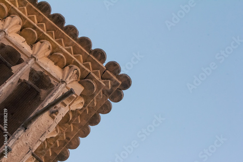 Decorative details of plaster work and brick work on a wind catcher - locally known as Badgir- in Yazd, Iran illustrating ethnic masonry and traditional construction.