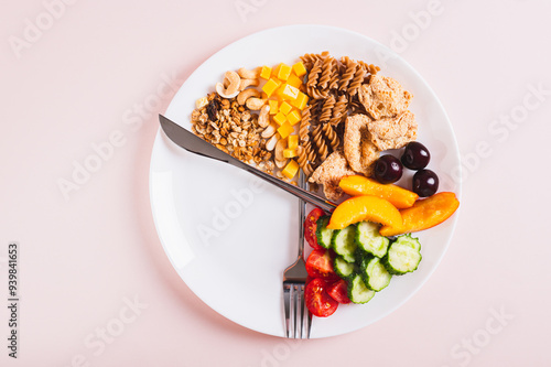 Obraz na płótnie Concept individual meal plan by time food on plate on table top view w salonie
