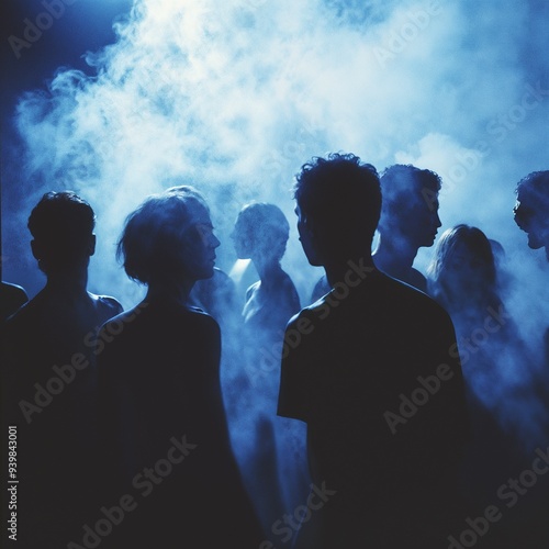 Mysterious Crowd Silhouettes Emerging from Ethereal Blue Haze