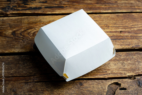 Blank white burger carton box mock up on wooden background