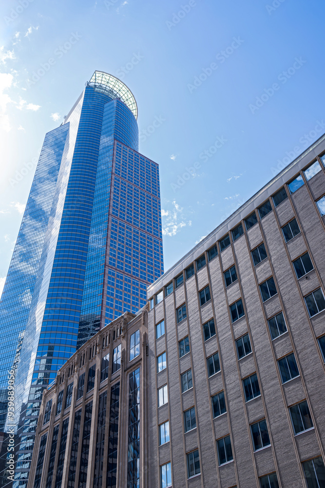 modern architecture of glass office tower rising above historic multi purpose building in downtown minneapolis minnesota modern architecture of glass office tower rising above historic multi purpose building in downtown minneapolis minnesota