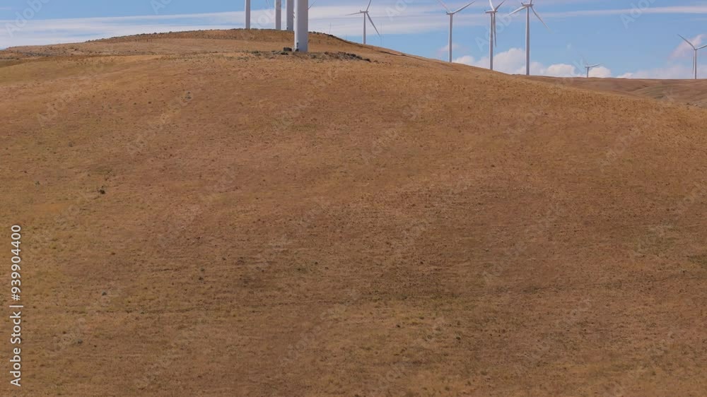 Goldendale, WA Wind Farm, Columbia River Gorge National Scenic Area: Aerial Drone view of the Wind Turbines at Goldendale, Washington. Slow crane up ascending reveal a medium shot. Goldendale, WA Wind Farm, Columbia River Gorge National Scenic Area: Aerial Drone view of the Wind Turbines at Goldendale, Washington. Slow crane up ascending reveal a medium shot.