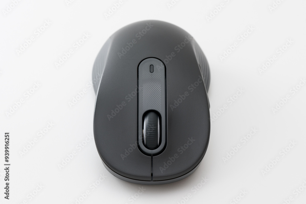 Black computer mouse on the blue background. Black computer mouse on the blue background.
