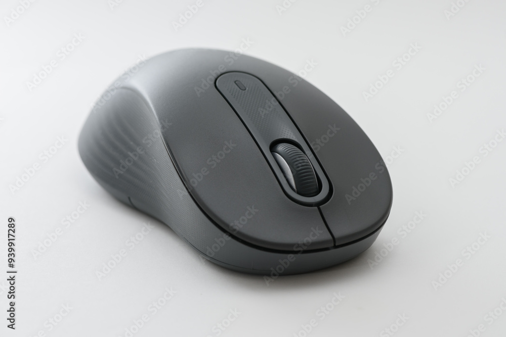 Black computer mouse on the blue background. Black computer mouse on the blue background.
