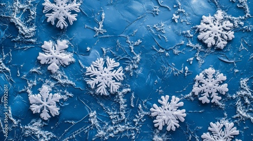 Snowflakes on Blue Textured Background
