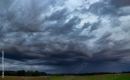 Storm clouds in the sky, rain on the horizon, summer season. Asperitas clouds.