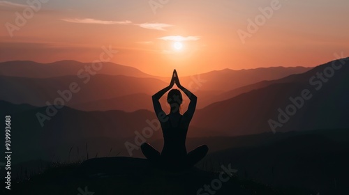Silhouette of a woman practicing yoga at sunset in the mountains