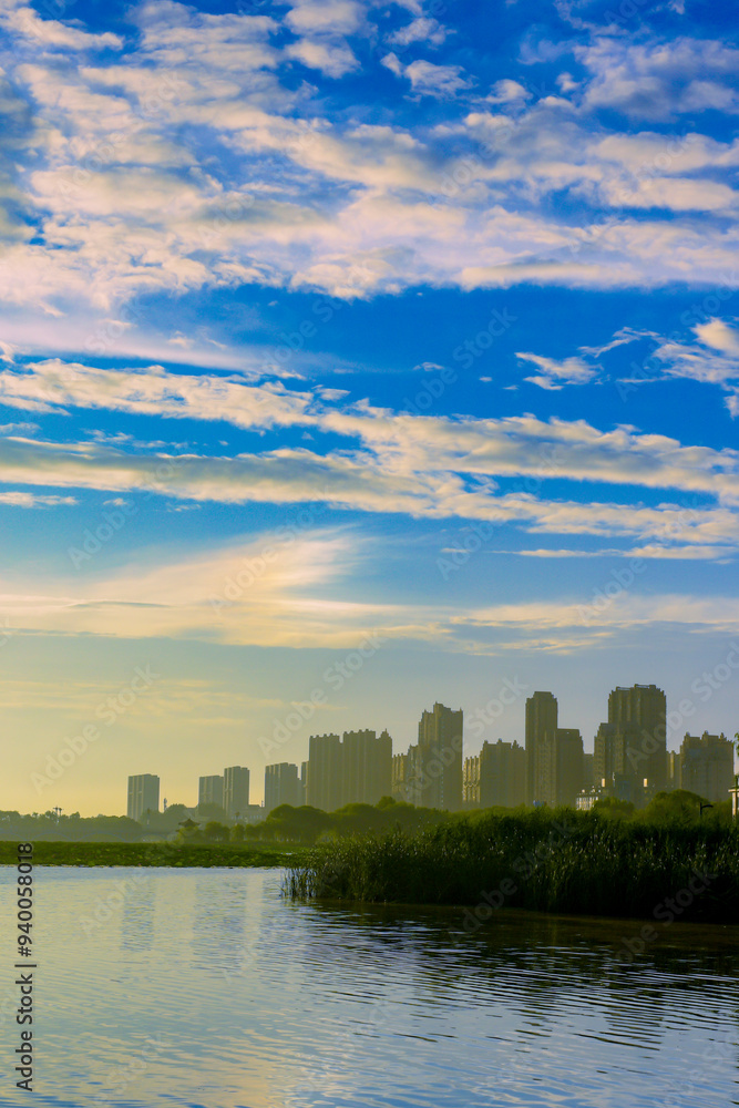 The skyline of urban rivers, the brilliant scene of blue sky, white clouds, sunset, and sunrise The skyline of urban rivers, the brilliant scene of blue sky, white clouds, sunset, and sunrise