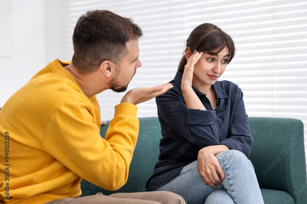 Man sending air kiss to embarrassed woman at home Man sending air kiss to embarrassed woman at home