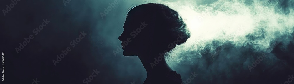 Silhouette of a woman against a misty background, evoking mystery and elegance in a captivating composition. Silhouette of a woman against a misty background, evoking mystery and elegance in a captivating composition.