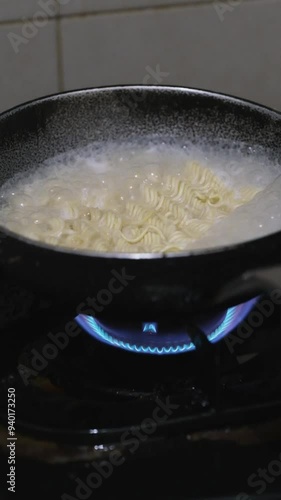 Cooking noodle with boiling water photo