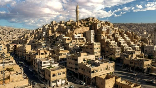 An aerial view of the historic city of Sana'a, Yemen, with its traditional architecture and minarets.
