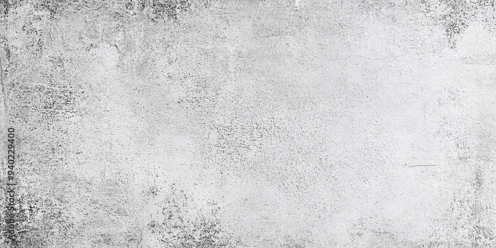 Fototapeta premium White grunge textured background with black speckled abstract design.